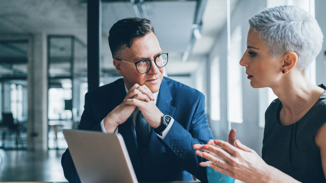 Two business people in conversation.